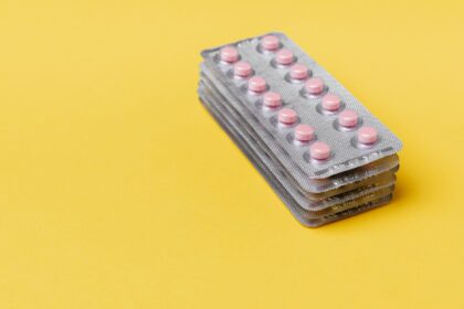 Yellow card symbol representing patient safety and adverse drug reaction reporting to the MHRA