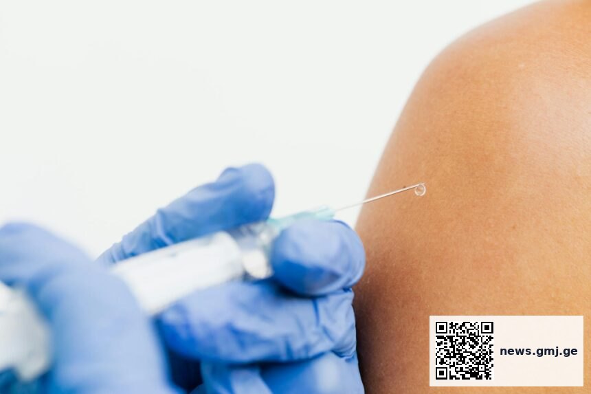 Medical professional preparing enhanced flu vaccine for older adult patient