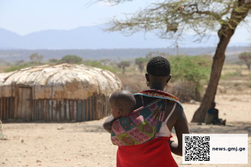 Kenyan mother holding newborn baby representing maternal health challenges after birth complications