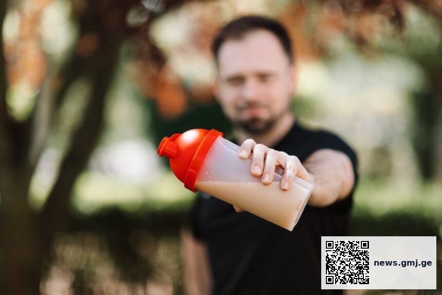 Laboratory researcher testing protein supplement formulations for taste and texture quality