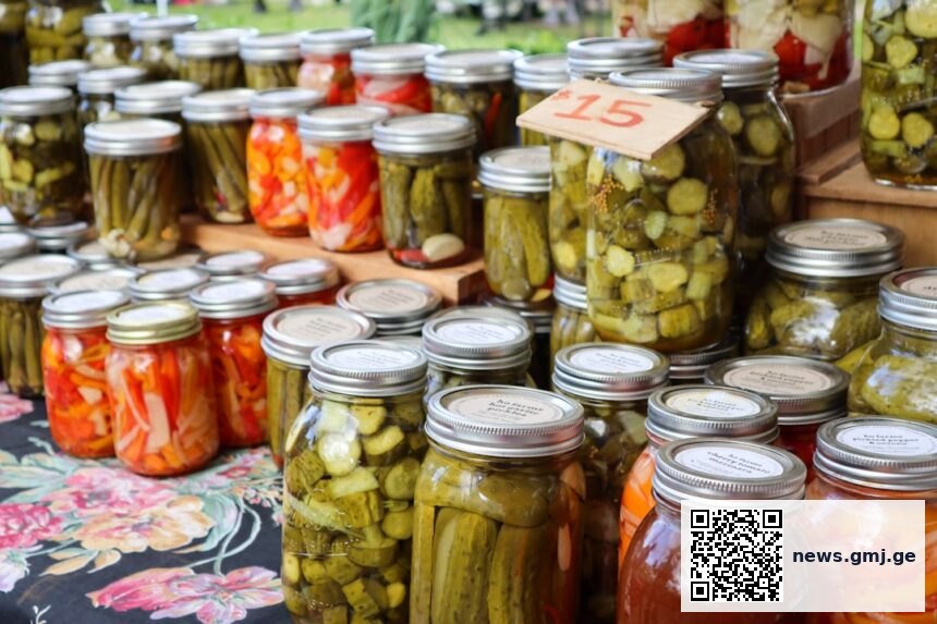 Chef preparing fermented vegetables in a kitchen setting