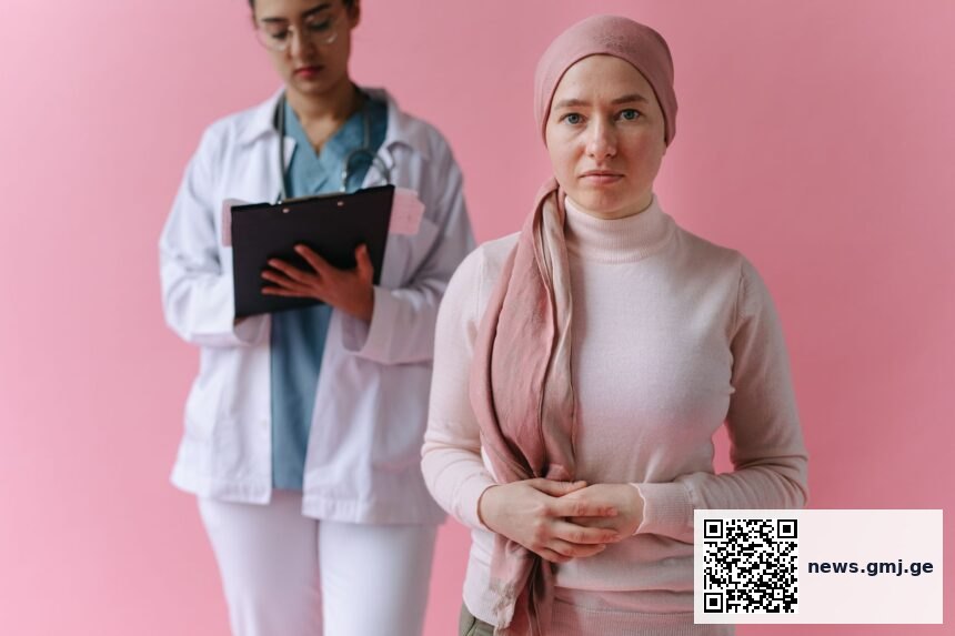 Thoughtful oncologist in conversation with patient, illustrating relational dimensions of cancer care